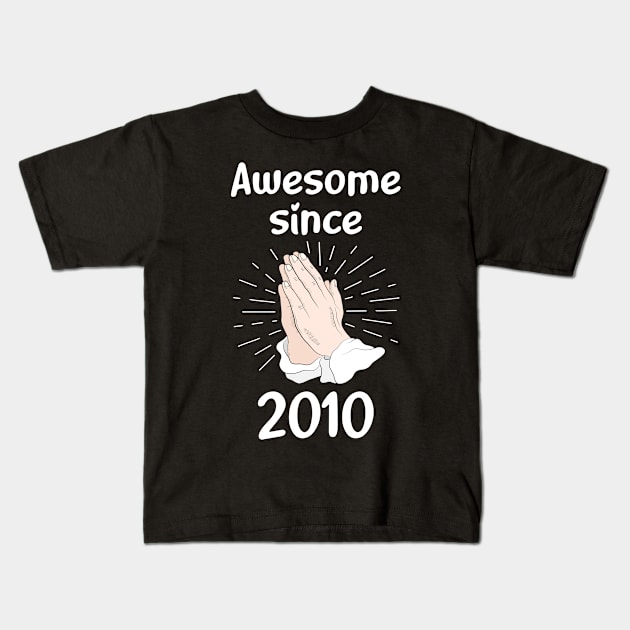 Praying Year 2010 Kids T-Shirt by ravenwaldo168375